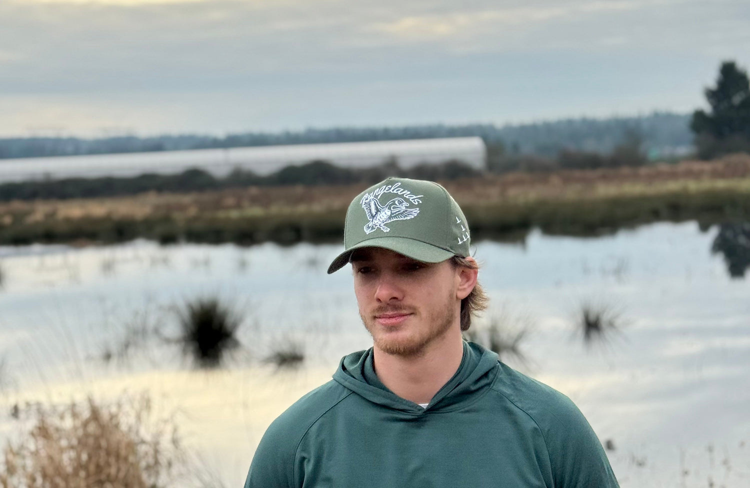 Talk To Me Goose Hat - Winter green hat with flying goose logo