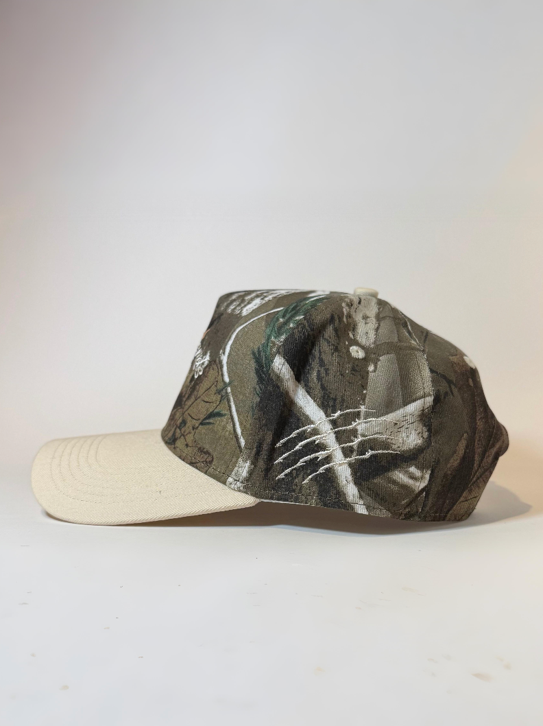 Side view of hat with the cat showing claw logo