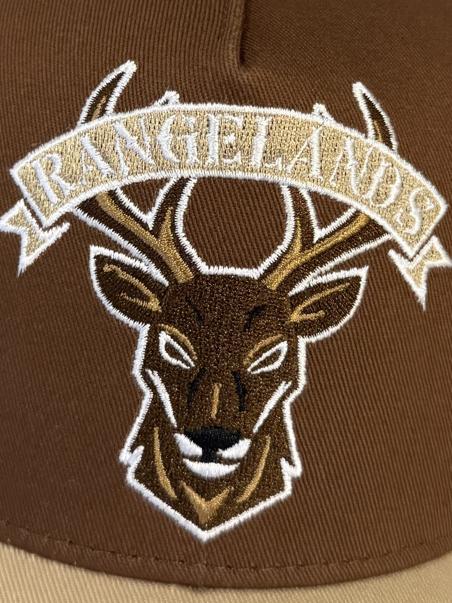 Leering buck logo with rangelands text above
