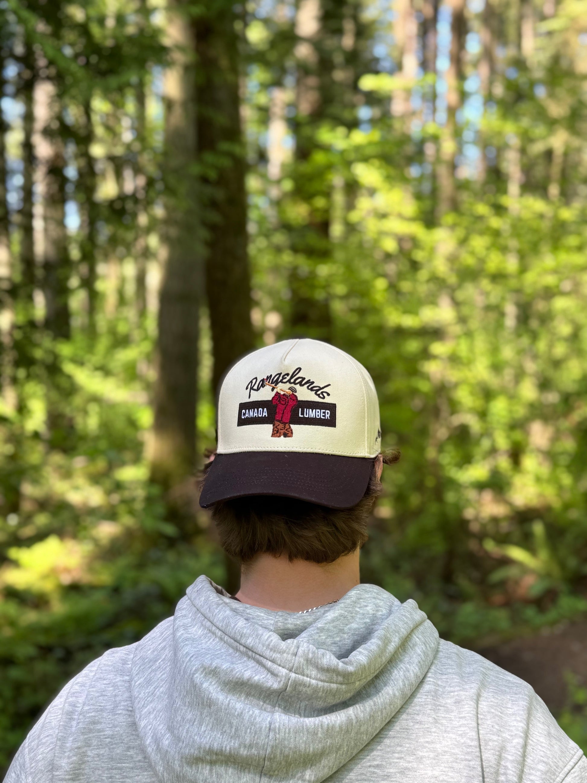 Lumberjack hat worn backwards in forest